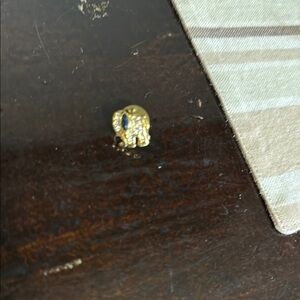 Gold Elephant Brooch with Blue Gem